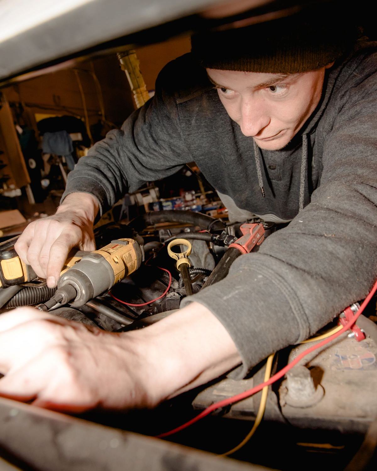 Mechanic working on a car engine