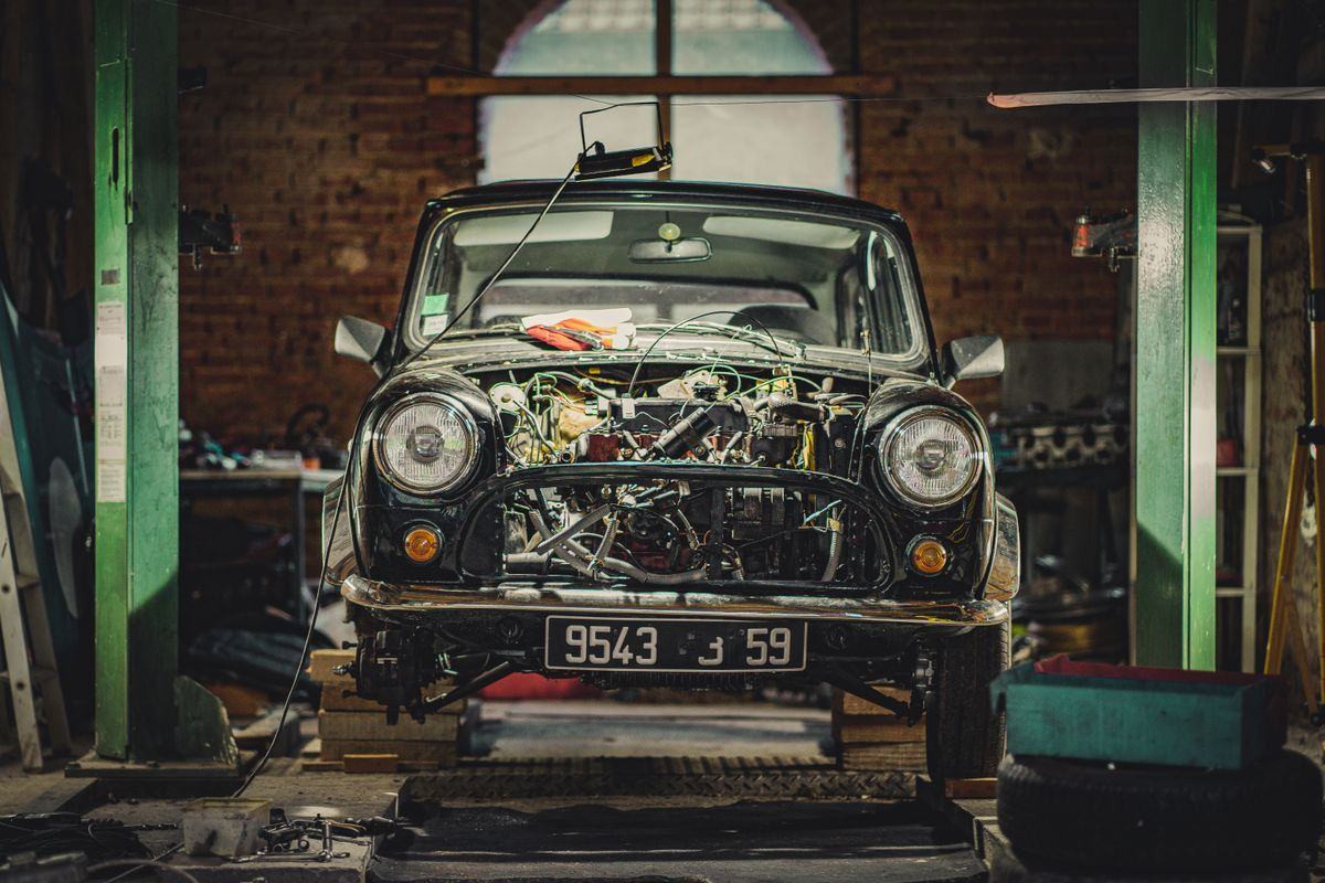 Classic Mini being restored in a garage